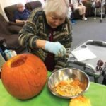 Dottie with pumpkin at adult day care