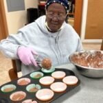Leila baking at Sarahcare adult day care center